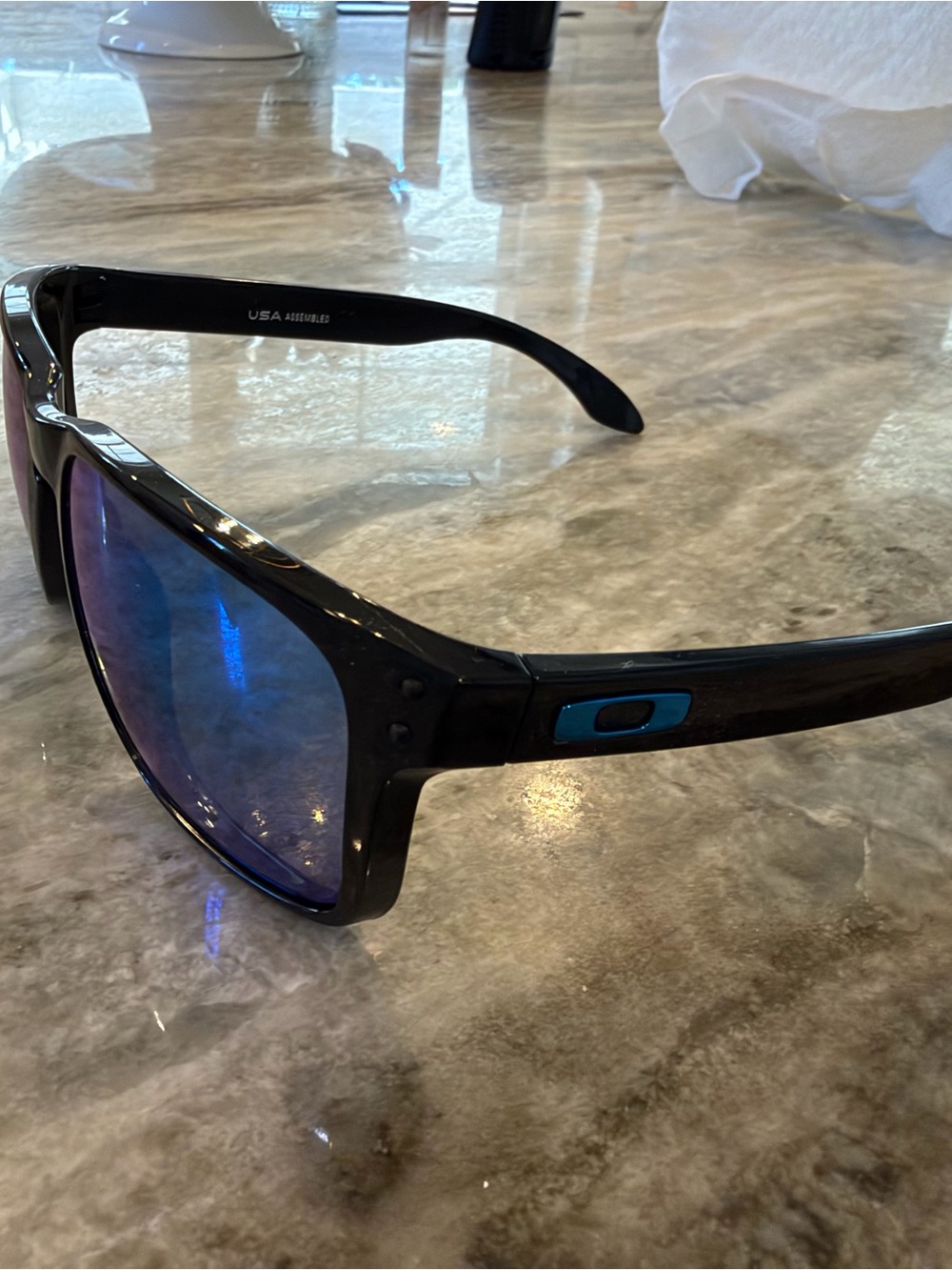 Oakley Black Frame Sunglasses with Blue Mirrored Lenses